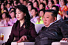 North Korean leader Kim Jong-un, right, and his daughter Kim Ju-ae, watch a performance marking International Women's Day on March 8 at Pyongyang Indoor Stadium, in this photo released the next day by the Korean Central News Agency. [NEWS1]