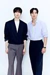Shownu X Hyungwon, a subunit duo of boy band Monsta X, poses for photos after a group interview with journalists at Starship Entertainment's headquarters in southern Seoul on May 19. [STARSHIP ENTERTAINMENT]