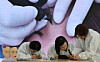 Students learn how to do eyebrow tattoos at an academy in Gangnam District, southern Seoul, on Sept. 26, 2025. [YONHAP]