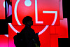 An attendee passes by a display of LG evo W6 Wallpaper televisions at the LG Electronics booth during CES 2026 in Las Vegas on Jan. 7. [REUTERS/YONHAP]