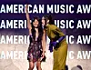 Rei Ami, left, and EJAE speak onstage during the 2026 American Music Awards at MGM Grand Garden Arena in Las Vegas, Nevada, on May 25. [AFP/YONHAP]