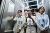 People appear disinterested in engaging in an elevator in an undated photo. [GETTY IMAGE PRO]