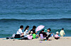A family spends time on a beach in Gangwon on April 13. [YONHAP]