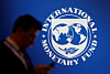 A person stands near a logo of the International Monetary Fund during the World Bank Annual Meeting 2018 in Nusa Dua, Bali, Indonesia, October 12, 2018. [REUTERS/YONHAP]
