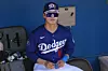 Los Angeles Dodgers' Kim Hye-seong pauses in the dugout prior to a spring training baseball game against the Oakland Athletics in Phoenix, Arizona, on March 21. [AP/YONHAP]