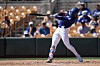 Los Angeles Dodgers' Kim Hye-seong connects for a run-scoring single against the Athletics during the third inning of a spring training baseball game in Phoenix on March 21. [AP/YONHAP]
