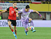Lee Tae-seok, right, tries to run past Christoph Baumgartner of Austria during the teams' friendly football match at Ernst-Happel-Stadion in Vienna on March 31, 2026. [YONHAP]