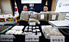 Investigators display confiscated items, including dried marijuana and marijuana cultivation equipment, at the briefing room of the Suwon District Prosecutors’ Office in Suwon, Gyeonggi, on Feb. 12. [NEWS1]