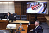 Former President Yoon Suk Yeol, right, attends former Prime Minister Han Duck-soo's insurrection trial at the Seoul Central District Court in Seocho District, southern Seoul, on Nov. 19, 2025, in this file photo provided by the court. [YONHAP]