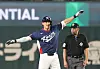 Shay Whitcomb does the 'airplane' celebration after bagging a double against Australia in Korea's final pool game of the World Baseball Classic in Tokyo on March 9. [YONHAP]