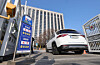 A car enters the front of the gate to the parking lot of the government complex in Jongno District, central Seoul, on March 25, the day the Ministry of Climate, Energy and Environment started to enforce a five-day rotation system for public-sector vehicles. [KANG JUNG-HYUN]