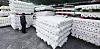 A person looks at bolts of fabric stacked outside a factory in Gyeongsan, North Gyeongsang on March 12.