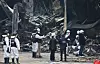 Police and fire personnel inspect the site of a blaze at an auto parts factory in Daejeon on March 22. The fire, which broke out on Friday, resulted in 14 deaths. [NEWS1]