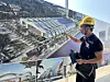 Truong Hoang Hai, the design manager for the APEC 2027 project, points to a master plan for the APEC Convention and Exhibition Center during a walkthrough of the construction site in Phu Quoc on April 18. [SEO JI-EUN]