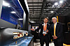 Steve Jeong, left, senior vice president and head of naval ship at Hanwha Ocean, introduces a model of KSS-III submarine to Victor Fedeli, Ontario's Minister of Economic Development, at the company's booth during CANSEC 2026 in Ottawa. [HANWHA OCEAN]