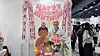 A monk poses with a Buddha standee at a Buddha-themed birthday cafe held at the 2026 Seoul International Buddhism Expo[WOO JI-WON]