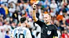 Spanish referee Antonio Mateu Lahoz shows a yellow card to Argentina's Lionel Messi during a quarterfinal of the 2022 Qatar World Cup between the Netherlands and Argentina at Lusail Stadium in Doha, Qatar, on Dec. 9, 2022. [AFP/YONHAP]