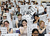 International students hold up their brush calligraphy works during a traditional calligraphy experience session at the “2025 Pusan National University Summer School” at Pusan National University in Geumjeong District, Busan, on July 9, 2025. [NEWS1]