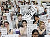 International students hold up their brush calligraphy works during a traditional calligraphy experience session at the “2025 Pusan National University Summer School” at Pusan National University in Geumjeong District, Busan, on July 9, 2025. [NEWS1]