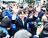 Democratic Party's candidate for Busan's Buk-A district, Ha Jung-woo, greets people at the Gupo Market in Busan on April 29. [YONHAP]