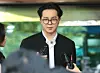 Song Min-ho, member of K-pop boy band Winner, leaves the Seoul Western District Court in Mapo District, western Seoul, on April 21. [NEWS1]