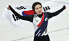 Short track speed skater Kim Gil-li celebrates after winning gold in the women's 1,500-meter final of the 2026 Milan-Cortina Winter Olympics in Milan on Feb. 20. [EPA/YONHAP]