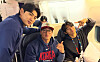 Korean national baseball team players Lee Jung-hoo, left, Ahn Hyun-min, center, and Kim Do-yeong pose for a photo on the team's flight to Miami, Florida for the World Baseball Classic quarterfinals, on March 11. [KBO]
