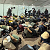 A still from footage uploaded to Israeli National Security Minister Itamar Ben-Gvir's X account shows detained activists handcuffed and kneeling on the ground. [SCREEN CAPTURE]