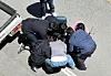 Police officers arrest Jang Yun-gi, who is accused of killing a teenage high school student he did not know in downtown Gwangju, on a road in Gwangsan District on May 5. [YONHAP]