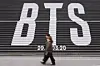 People walk by large BTS letters displayed on the steps of the Sejong Center for the Performing Arts in central Seoul on Jan. 15. [AP/YONHAP]