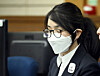 Kim Keon Hee closes her eyes as she appears for the first hearing in her corruption charges at the Seoul Central District Court in Seocho District, southern Seoul, on Sept. 24, 2025. [NEWS1]