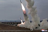 North Korea carries out a firepower strike drill involving 600-millimeter ultra-precision multiple rocket launchers on March 14, 2026, in this photo published by the Korean Central News Agency the following day. [YONHAP]