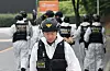 Investigators are seen on June 2 during their probe to identify the cause of explosion at Hanwha Aerospace's Daejeon plant, which happened a day earlier. [NEWS1]