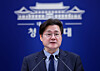 Hong Ihk-pyo, the presidential secretary for political affairs, attends a press conference at the presidential office in Seoul on March 25. [YONHAP]