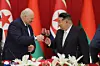 North Korean leader Kim Jong-un, right, and Belarusian President Aleksandr Lukashenko attend a banquet for the Belarusian leader in Pyongyang on March 26, as seen in a photo carried by North Korea's official Korean Central News Agency the following day. [YONHAP]
