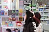 Foreign visitors browse cosmetics at shops in Myeongdong, Jung District, central Seoul, on Dec. 21, 2025. [YONHAP]