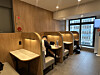 A customer focuses on his laptop inside an individual study capsule at a franchise cafe in Jongno District, central Seoul, on May 19. [SEO JI-EUN]