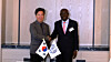Korean Labor Minister Kim Young-hoon, left, shakes hands with International Labour Organization Director-General Gilbert Houngbo in central Seoul on May 21. [MINISTRY OF EMPLOYMENT AND LABOR]