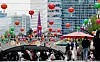 Passersby walk along Cheonggyecheon in central Seoul on May 12 beneath lotus lanterns hung ahead of Buddha’s Birthday, which falls on May 24 this year. [NEWS1]