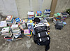 An official from the Ministry of Culture, Sports and Tourism's Copyright Crime Special Unit looks at piles of pirated texts on April 22 after arresting the suspect who ran a pirating service for nearly five years [MINISTRY OF CULTURE, SPORTS AND TOURISM]