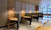 Single-person divider booths stand ready inside a Starbucks branch near Hanyang University's Erica Campus in Ansan, Gyeonggi. Major chains are increasingly introducing library-style infrastructure to institutionalize long-staying customers. [STARBUCKS KOREA]