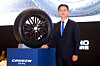 Kumho Tire CEO Jung Il-taik poses with the latest Crugen GT Pro tire, designed for premium SUVs, during a media event on March 17 in central Seoul. [KUMHO TIRE]
