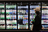 A shopper looks at milk at a grocery store in Seoul on Oct. 8, 2025. [YONHAP]