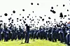 Newly commissioned Air Force officers toss their caps into the air after a commissioning ceremony for the 154th officer candidate class at the parade ground of the Air Force Education and Training Command in Jinju, South Gyeongsang, on May 27, 2025. [YONHAP]