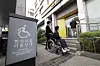 A wheelchair user and her companion on a street in Yeongdeungpo District, western Seoul, on April 30, 2023 [JOONGANG ILBO]