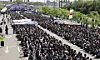 Members of Samsung Electronics-affiliated labor unions call on the company to scrap a longstanding cap on bonuses during a massive rally inside the company's campus in Pyeongtaek, Gyeonggi, on April 23. [JOINT PRESS CORPS]