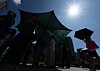 Pedestrians take shelter beneath a sunshade in Jongno District, central Seoul, on Sept. 5, 2025. [NEWS1]