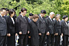 President Lee Jae Myung, second from left, observes a moment of silence at a memorial ceremony marking the 17th anniversary of the death of former President Roh Moo-hyun in the rural village of Bongha, Gimhae, South Gyeongsang, on May 23. [JOINT PRESS CORPS]