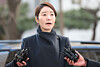 Democratic Party Rep. Kang Sun-woo answers questions from reporters before entering the Seoul Metropolitan Police Agency's Public Crime Investigation Unit in western Seoul on Jan. 20. [YONHAP]