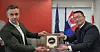 Park Yong-yeol, head of the Naval Ship Division at HD Hyundai Heavy Industries, right, and James Davies, CEO of Davie Shipbuilding, pose for a commemorative photo during a visit to Davie Shipbuilding’s Ottawa office on May 26 (local time). [HD HYUNDAI]